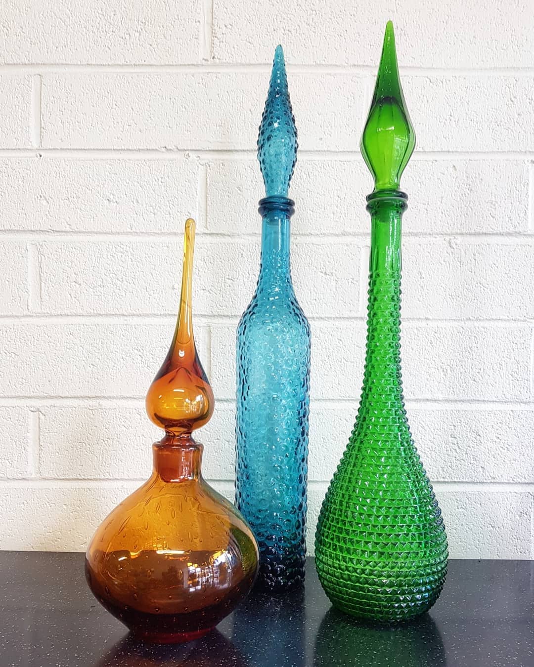 (L-R) Mid Century Amber Hand Blown Glass Genie Bottle, Italy c.1960  // Mid Century Blue Glass Bubble Genie Bottle, Italy c.1960  // Mid Century Green Glass Hobnail Genie Bottle, Italy c.1960 